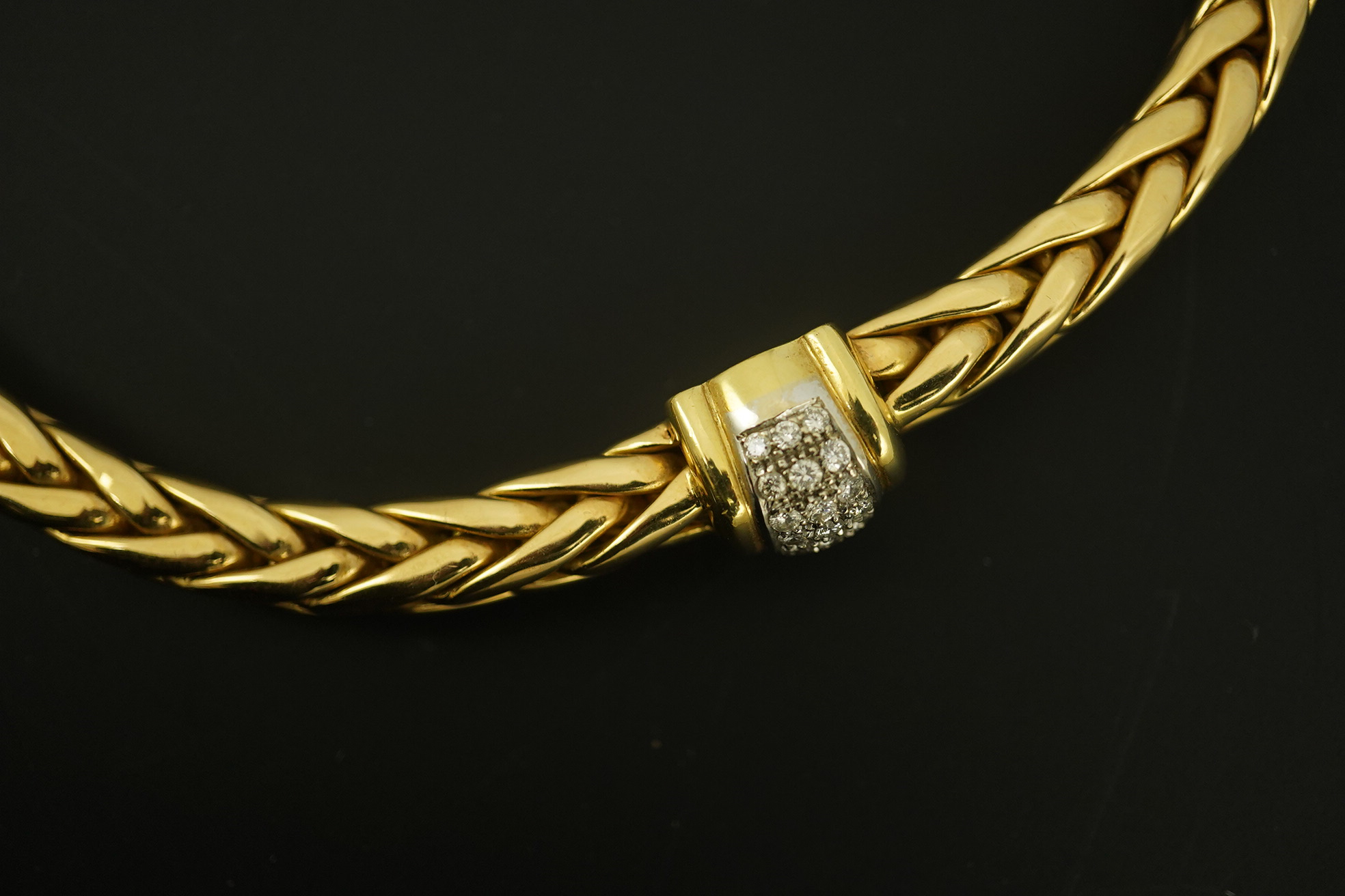 A modern Mappin & Webb 18ct gold interwoven link necklace, with two pave set diamond bands